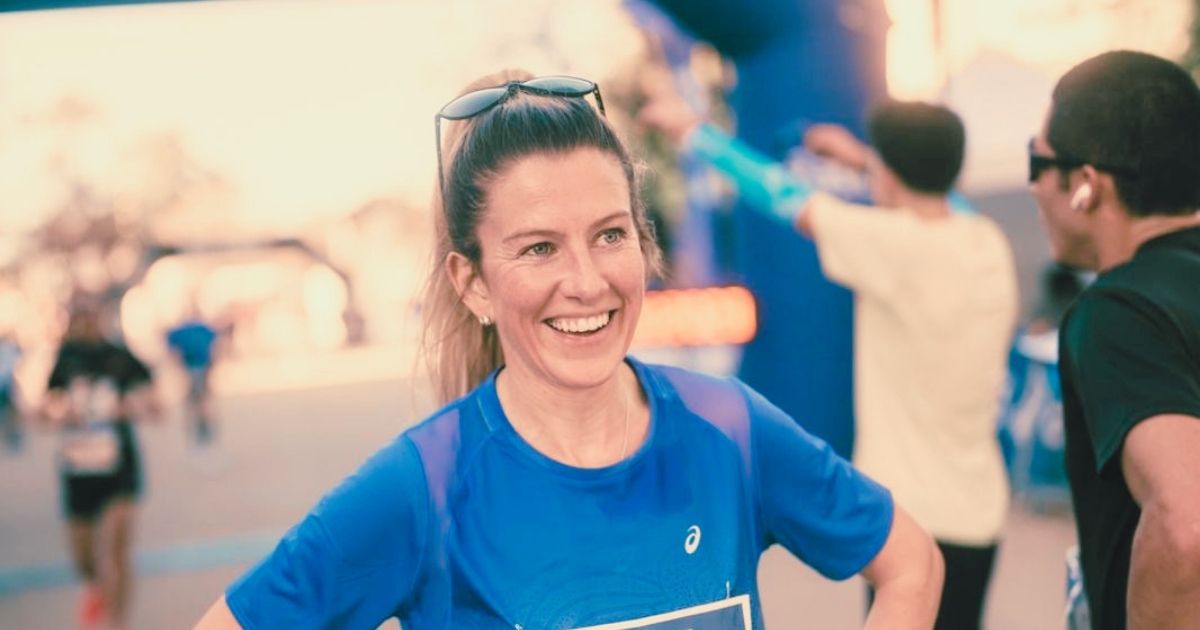 Sophie Mellor, female running coach at JM Coaching, running through the countryside