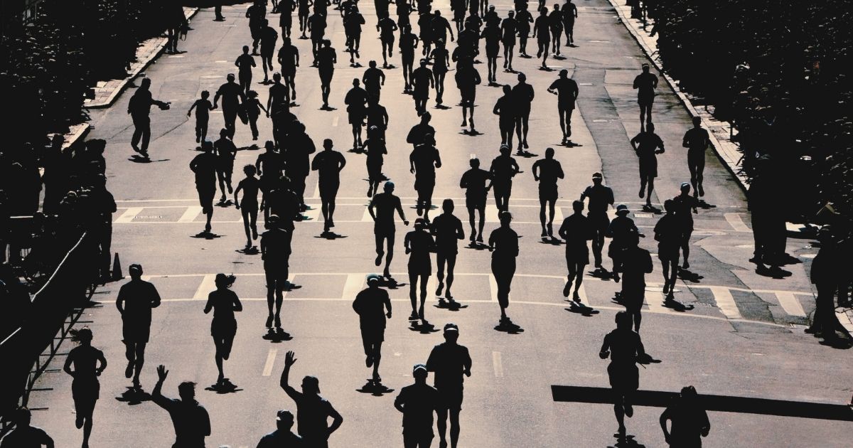 Marathon runner on an easy taper run on a quiet road three weeks before race day