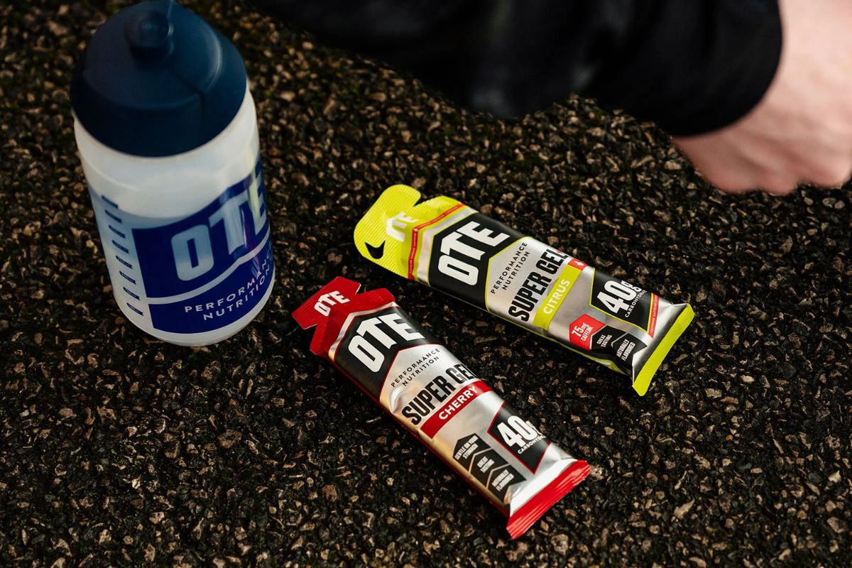 OTE Super Gels and Super Carbs sachets laid out for a marathon fuelling plan